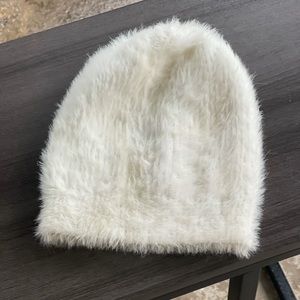 White fuzzy hat. Urban outfitters.